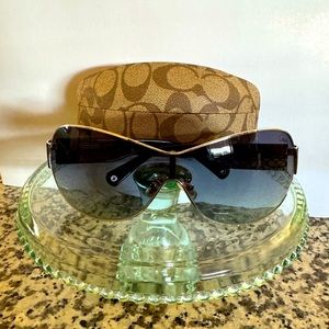 Coach Black wraparound sunglasses with the Coach C on the side